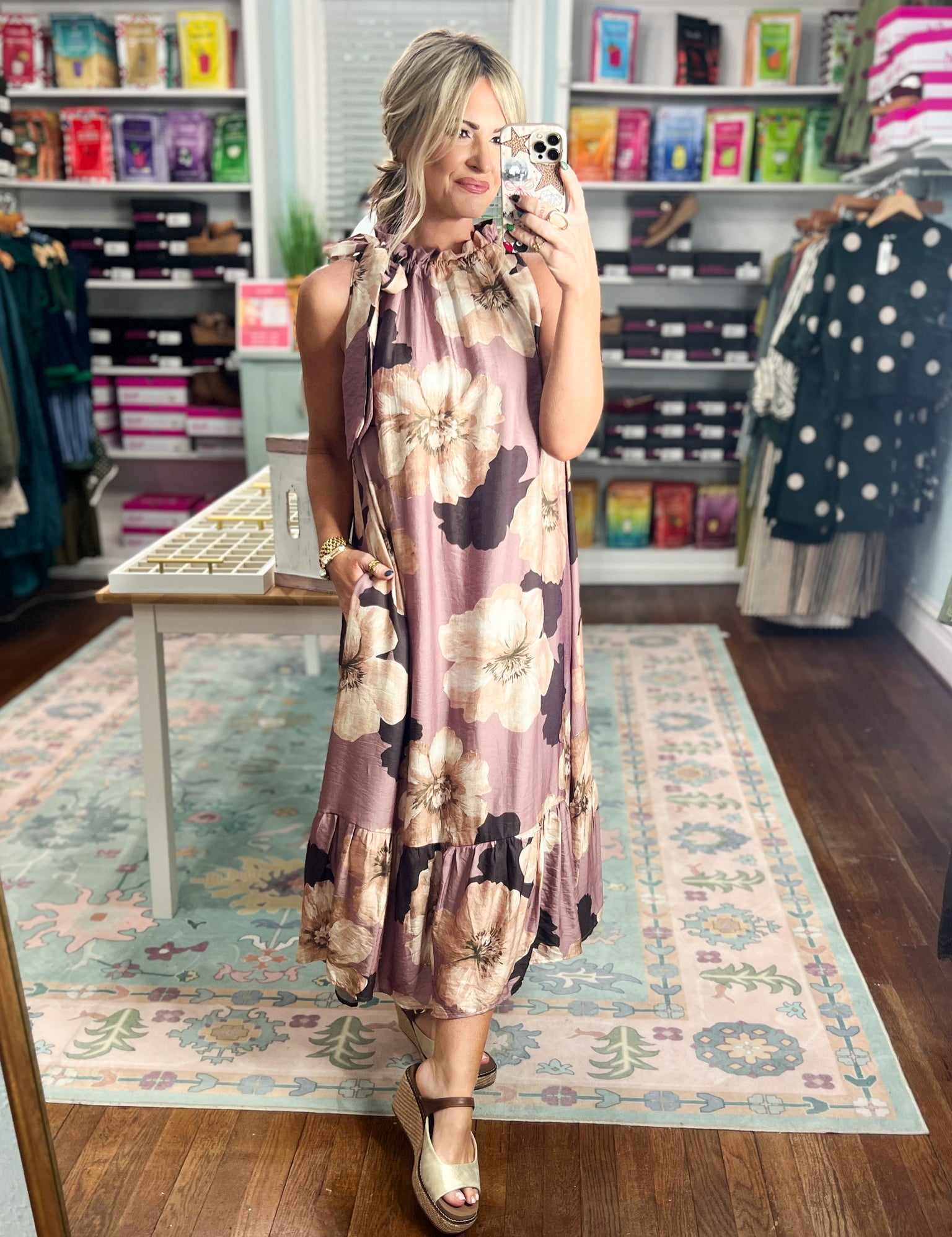 Sleeveless mauve midi dress with bold floral print, tiered ruffle hem and sleeveless cut