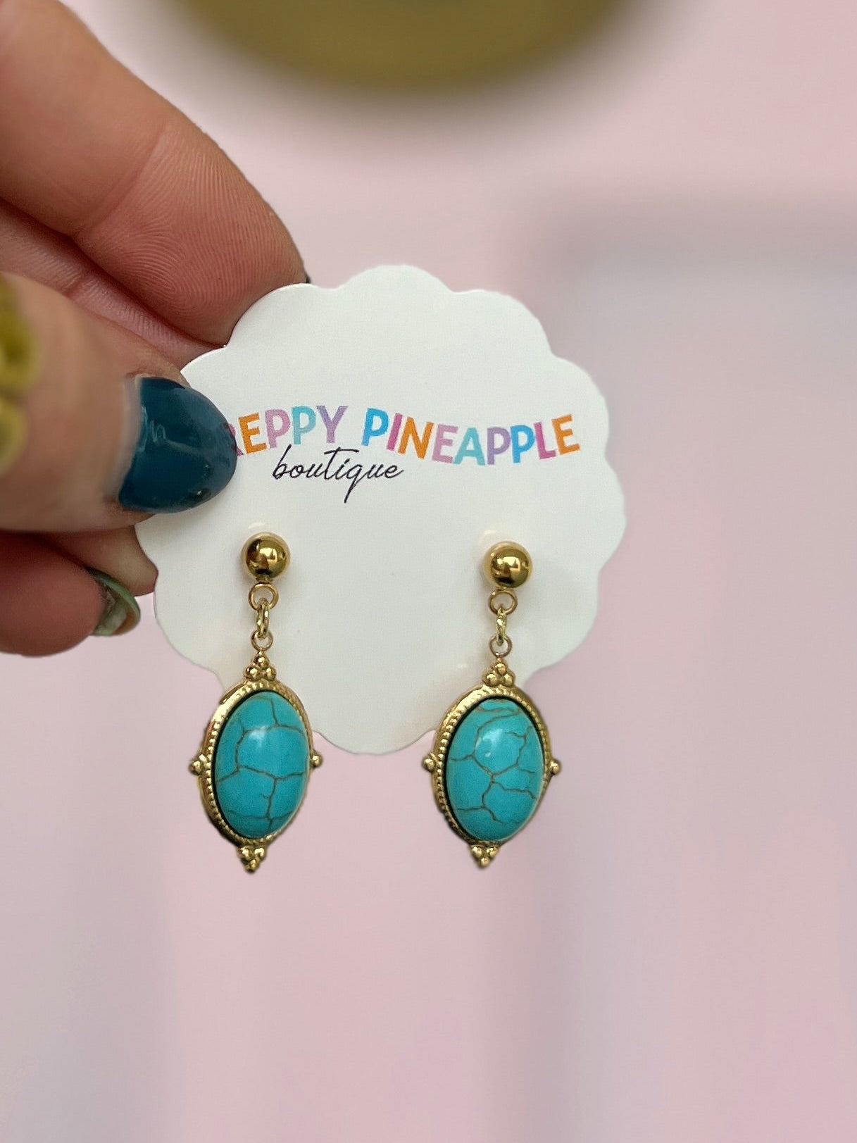 Gold-tone framed oval turquoise stone drop earrings with hook backs