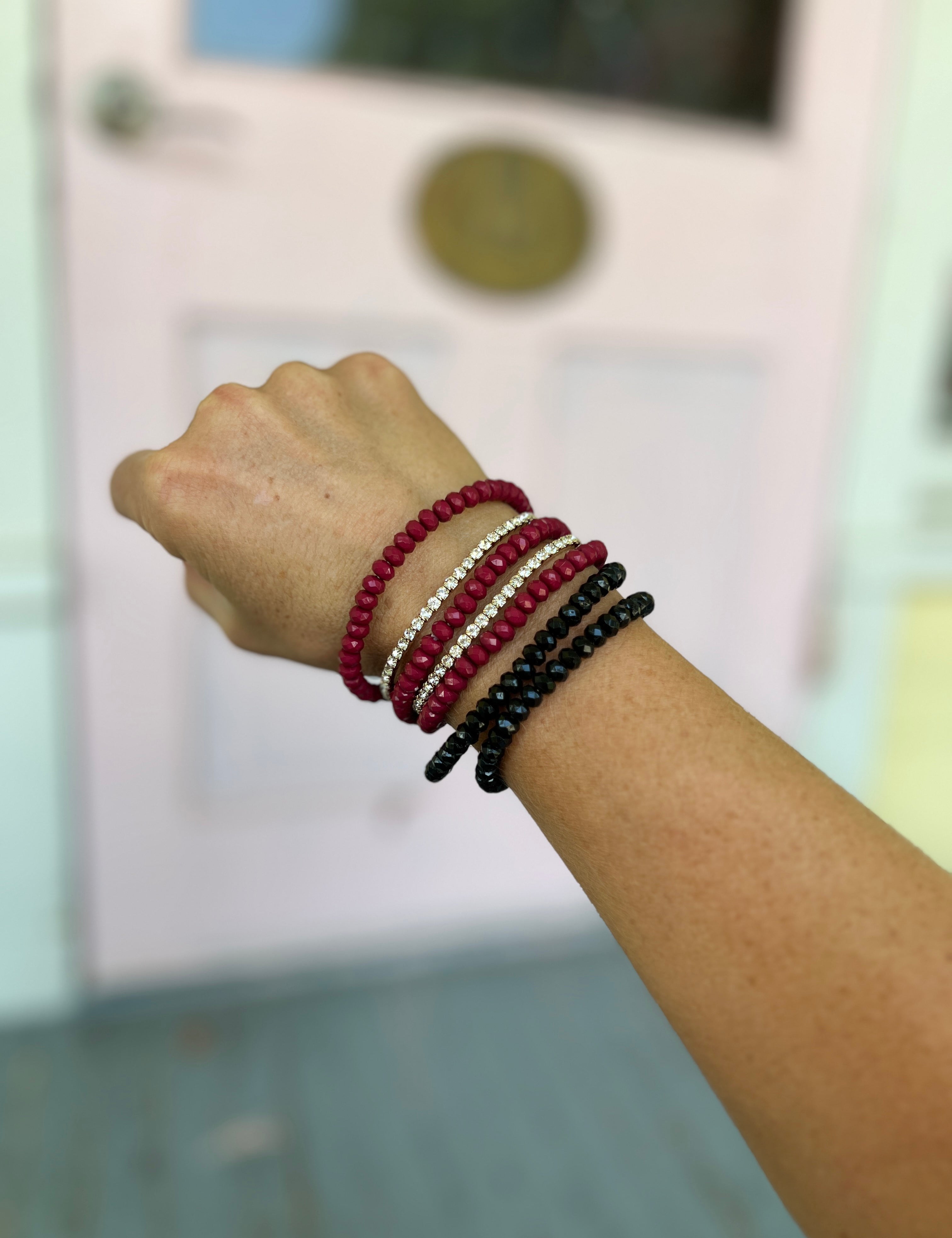 Burgundy and black seed bead bracelet set with three stacked beaded bands