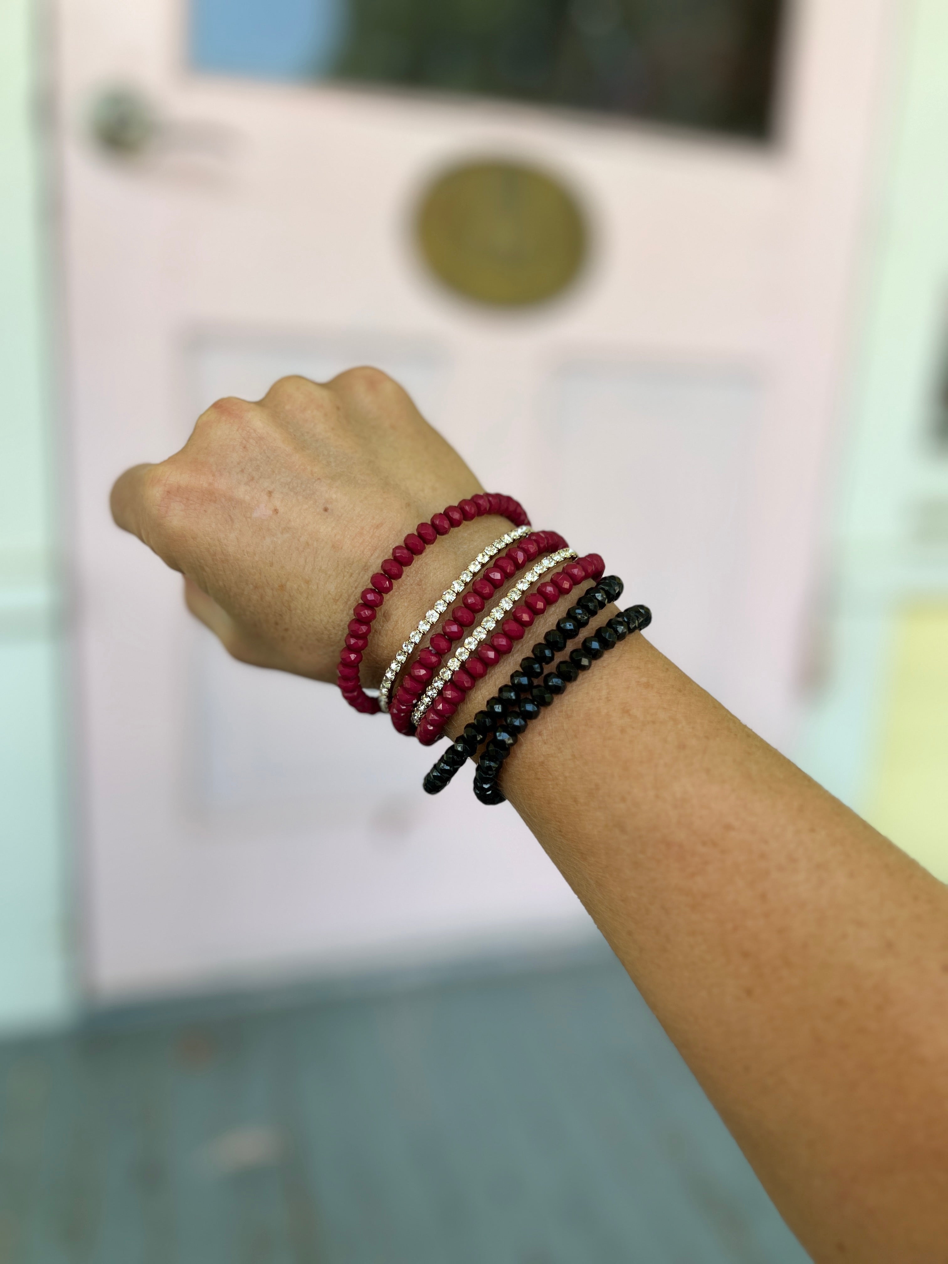 Burgundy and black seed bead bracelet set with three stacked beaded bands