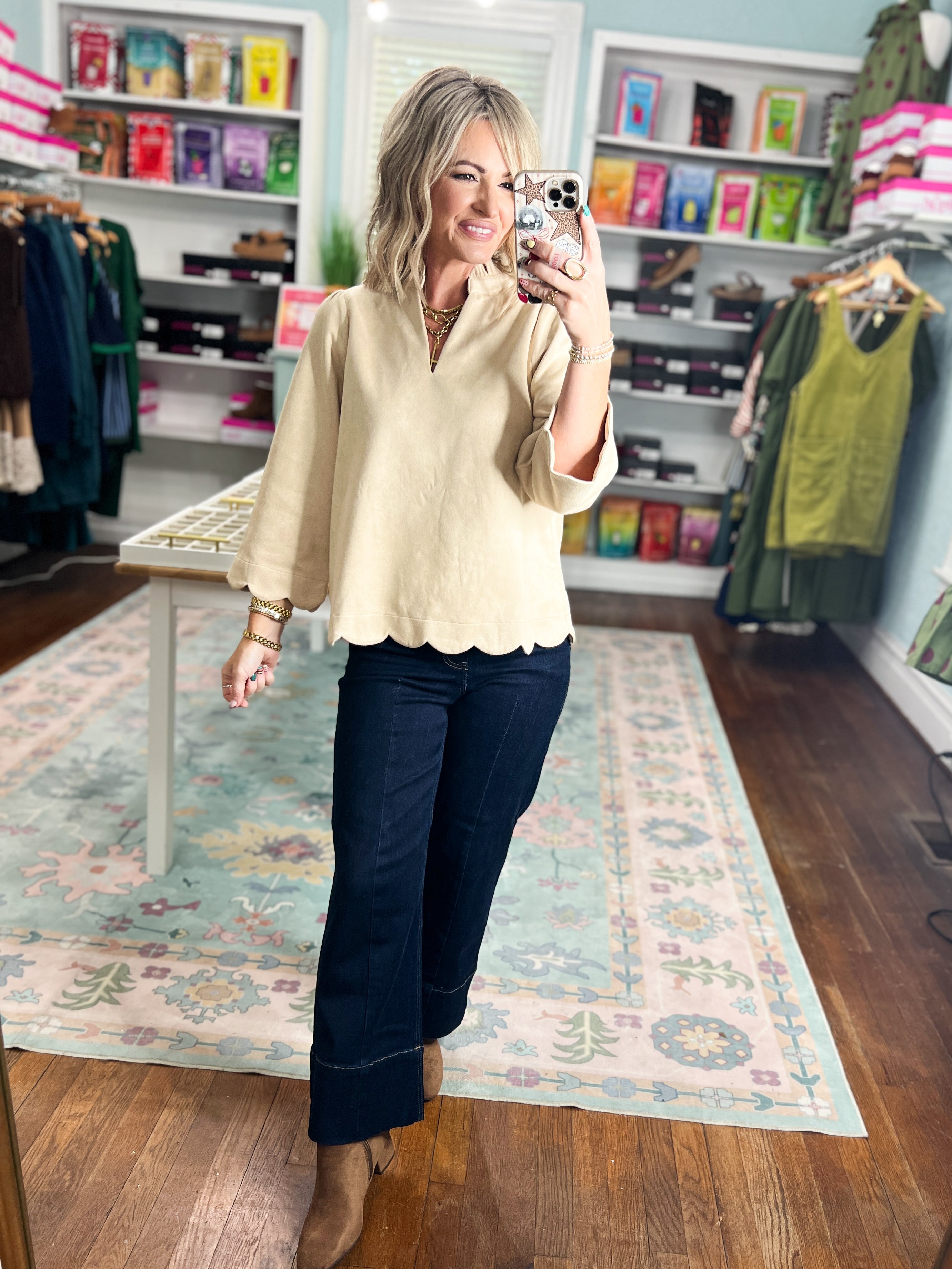 Champagne faux suede blouse with V-neck and scalloped hem, long sleeves.