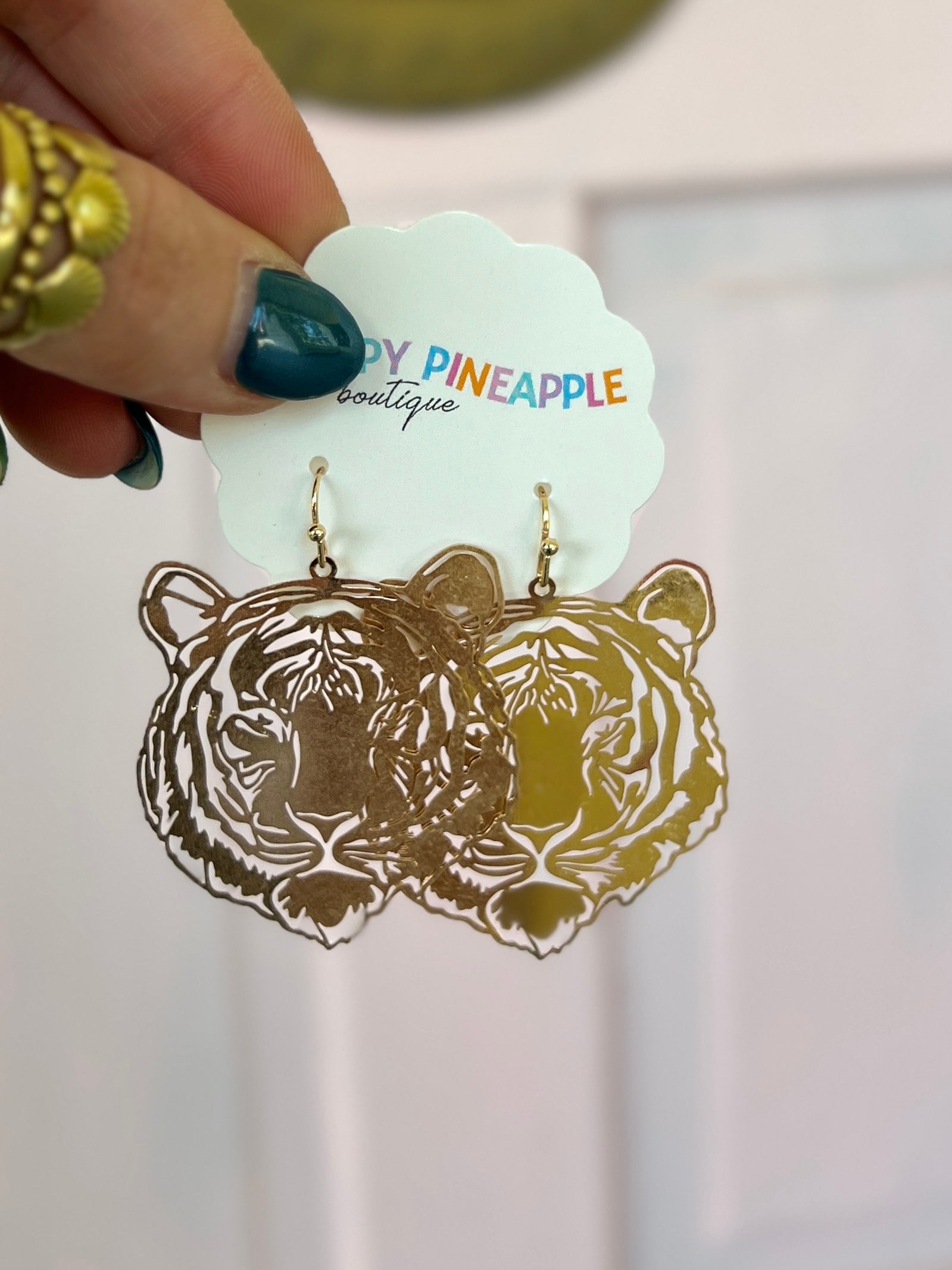 Gold tiger filigree drop earrings with two dangling tiger face outlines