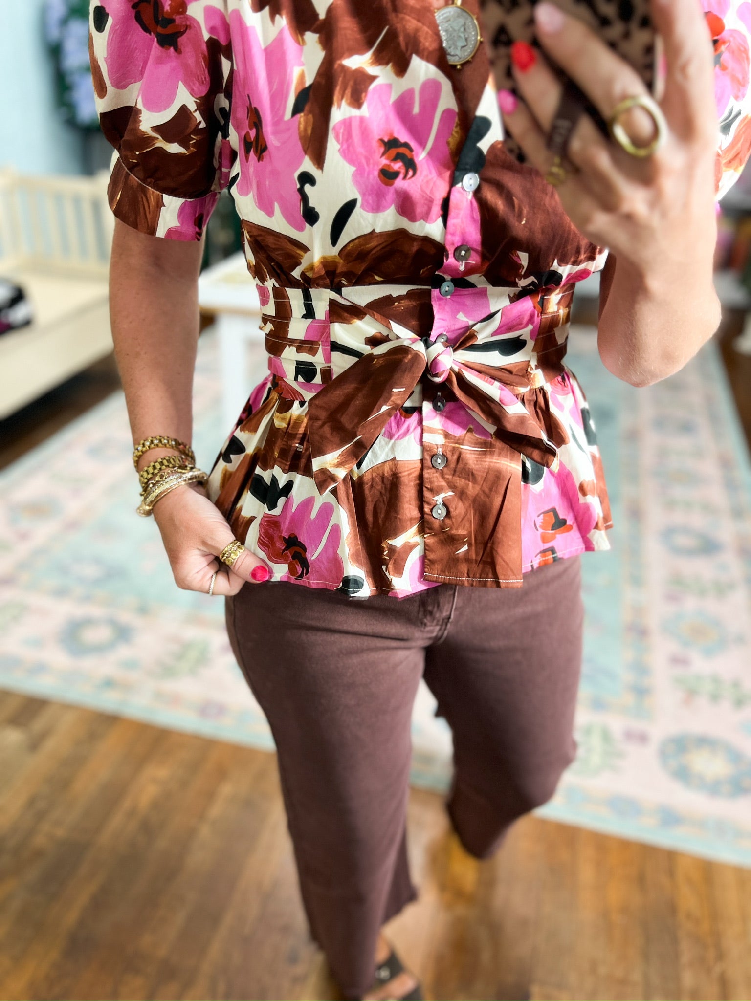 Floral button-front blouse detail with bow-tied waist, brown pink and white accents