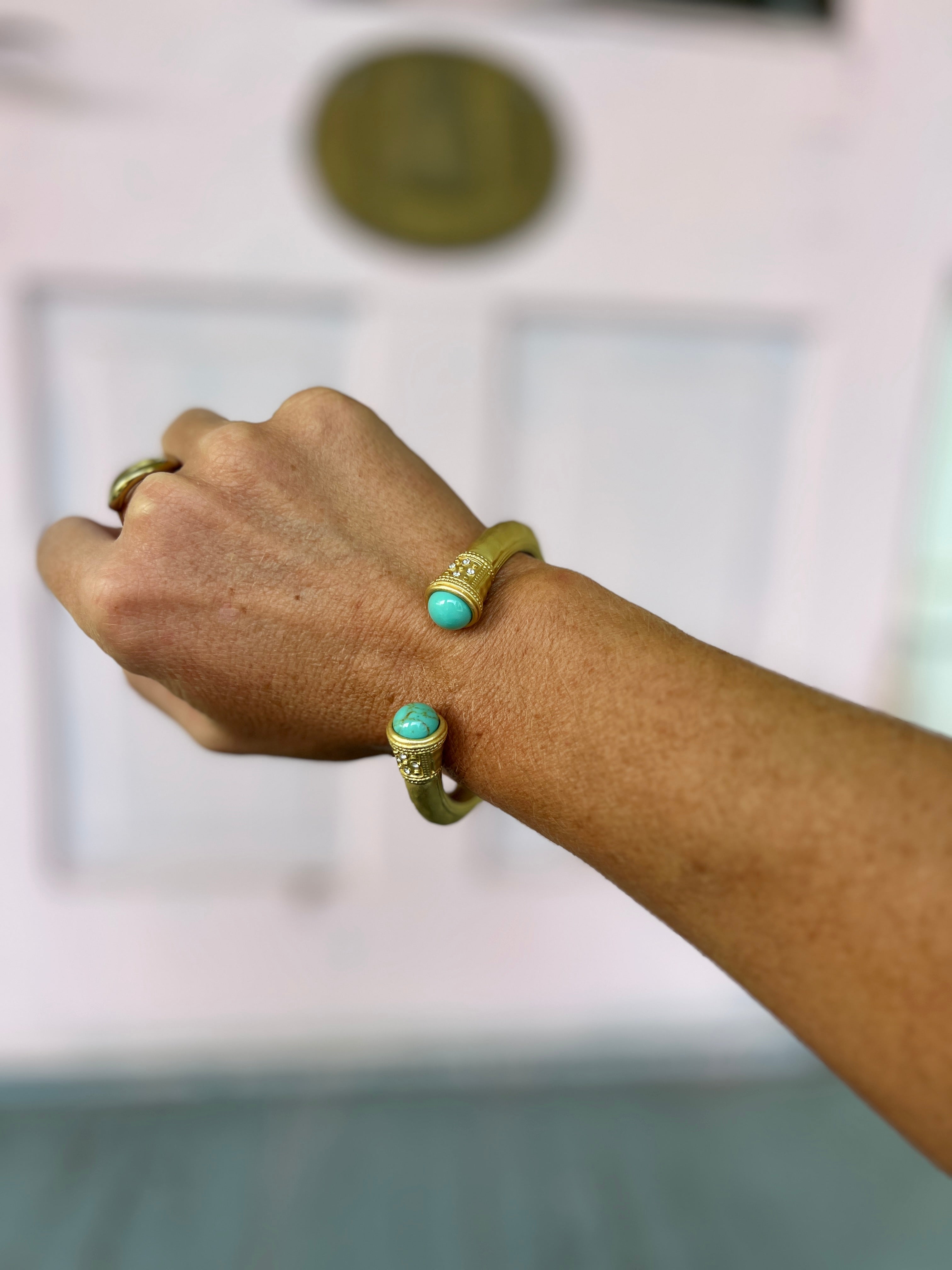 Hammered metal cuff bracelet with turquoise stone ends