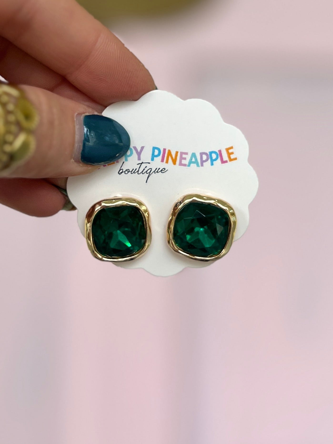 Square green stone stud earrings with gold-tone framed settings
