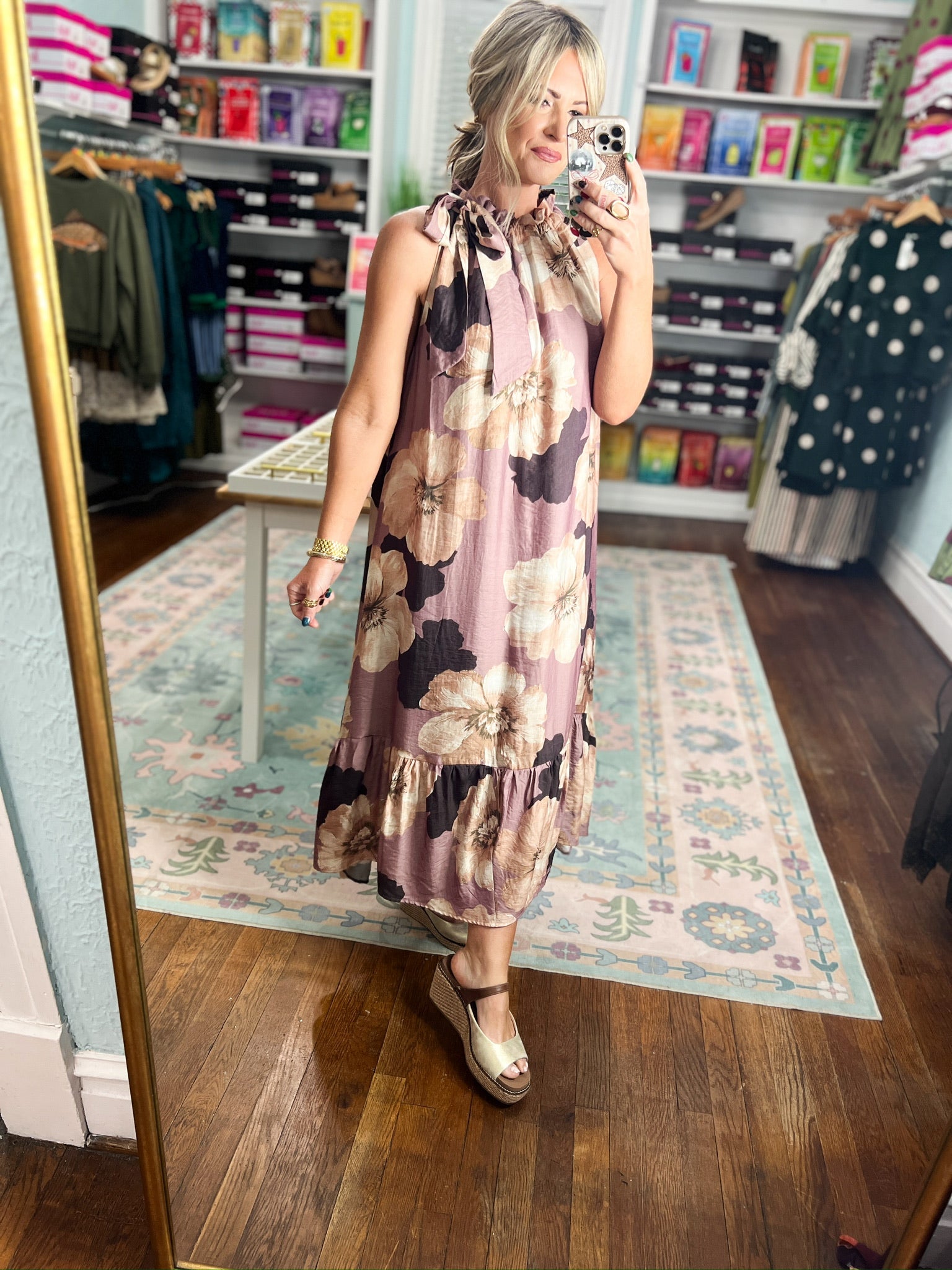Sleeveless mauve midi dress with large floral print, back tie straps and ruffled neckline