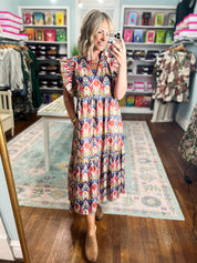 Multicolor tiered midi dress with geometric print and short ruffled sleeves, front view