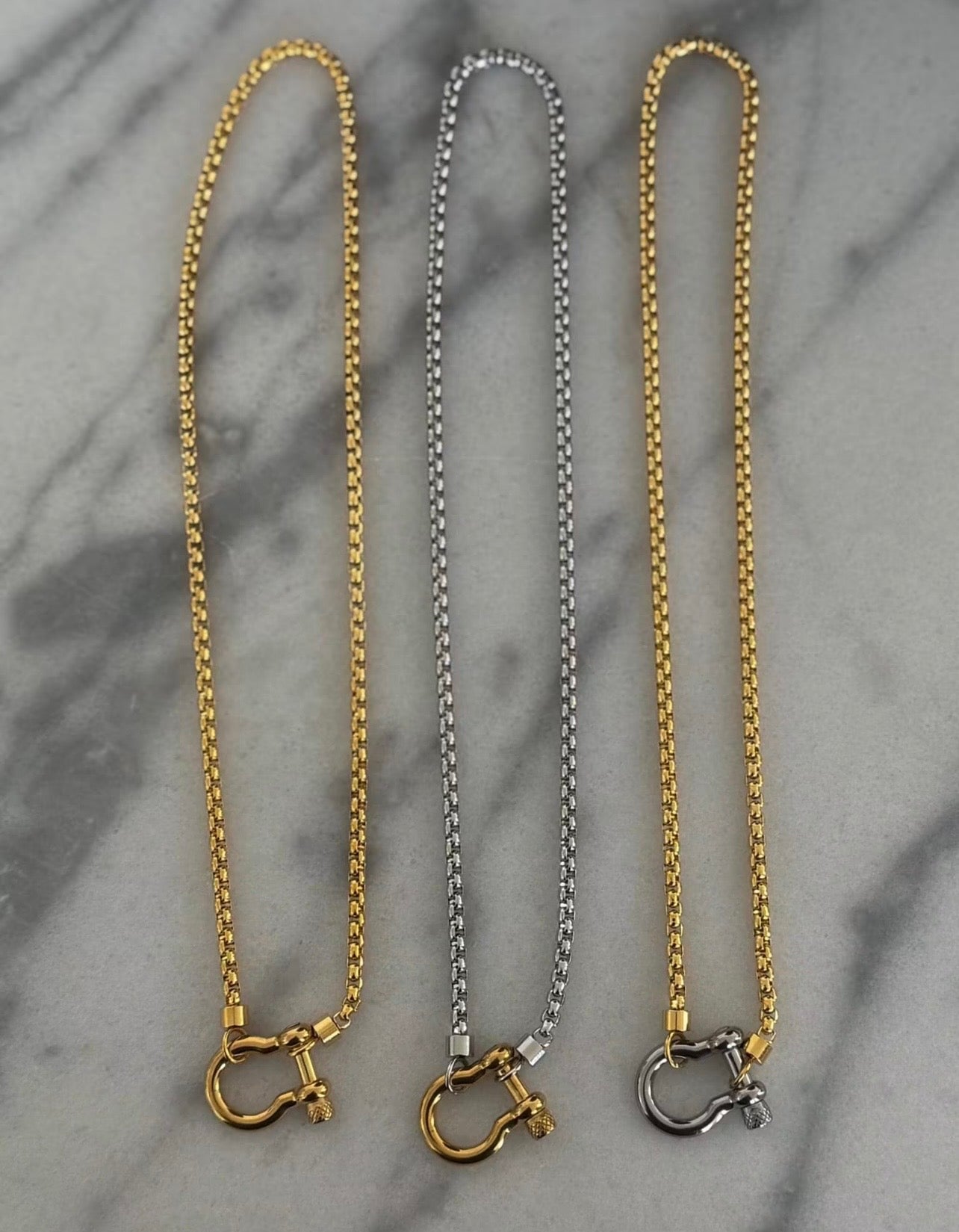 Locket necklace set with gold and silver chains and lobster clasp, three lengths shown