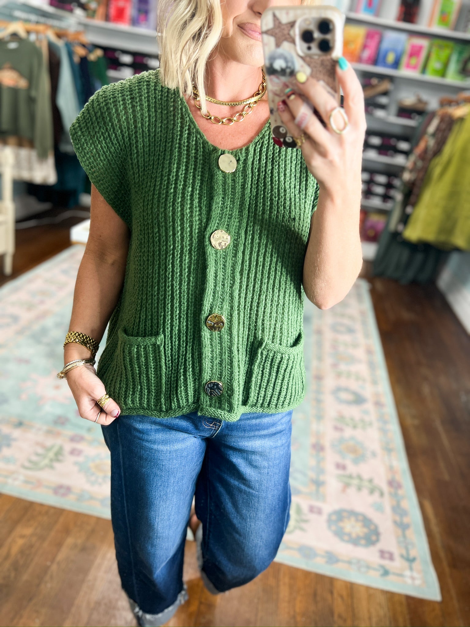 Army green knit button-front sweater with short sleeves and ribbed hem, small front pockets