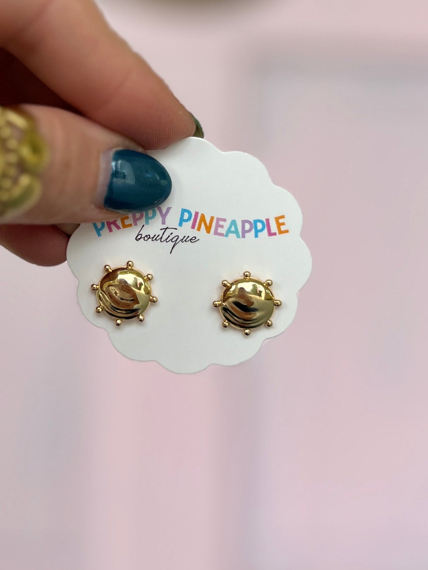Gold-tone dotted round stud earrings with small beaded ring detail