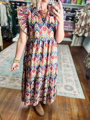 Multicolor tiered midi dress close-up with geometric print and ruffled short sleeves
