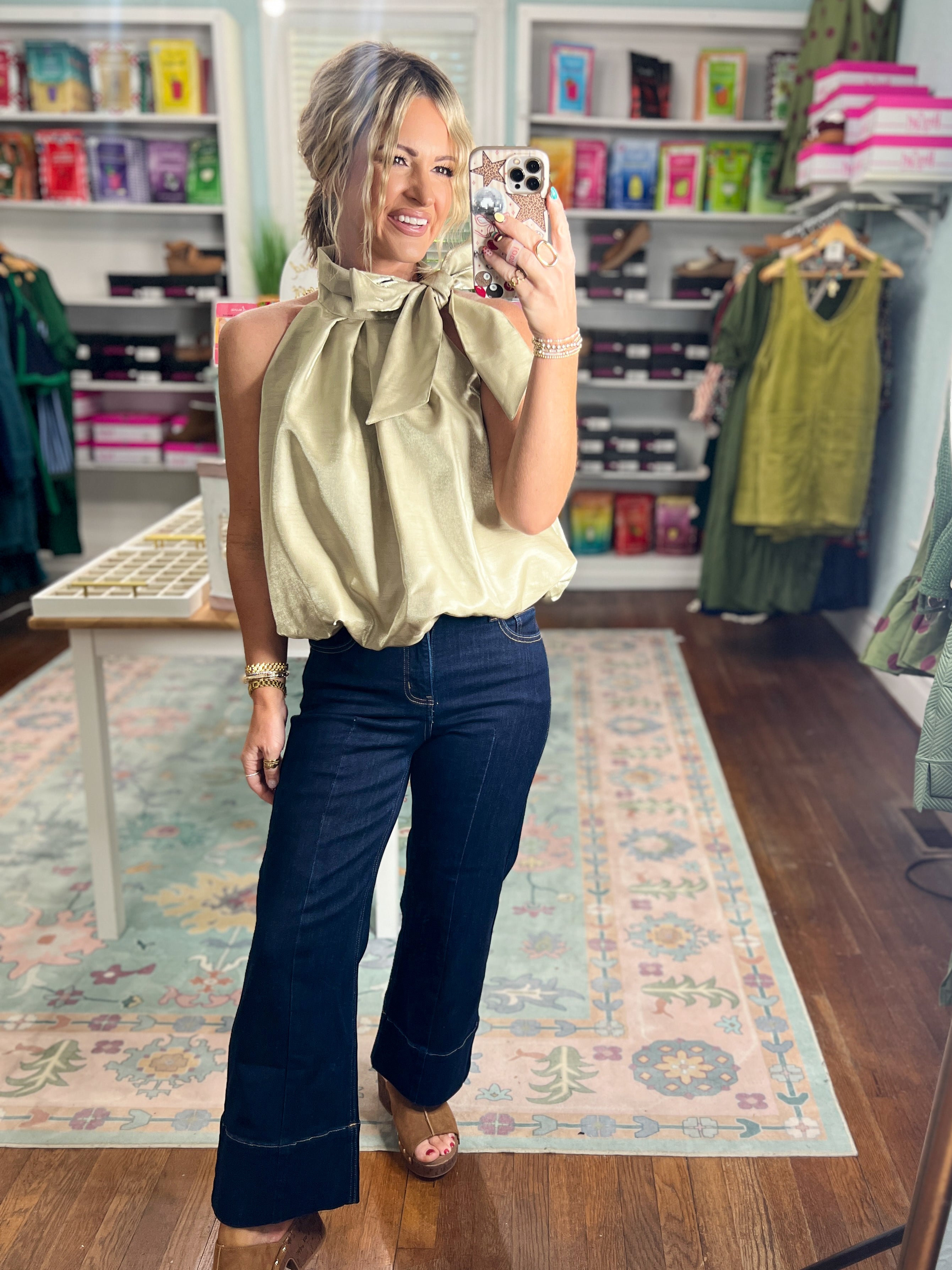 Taupe sleeveless balloon top with gathered high neck and pleated drape