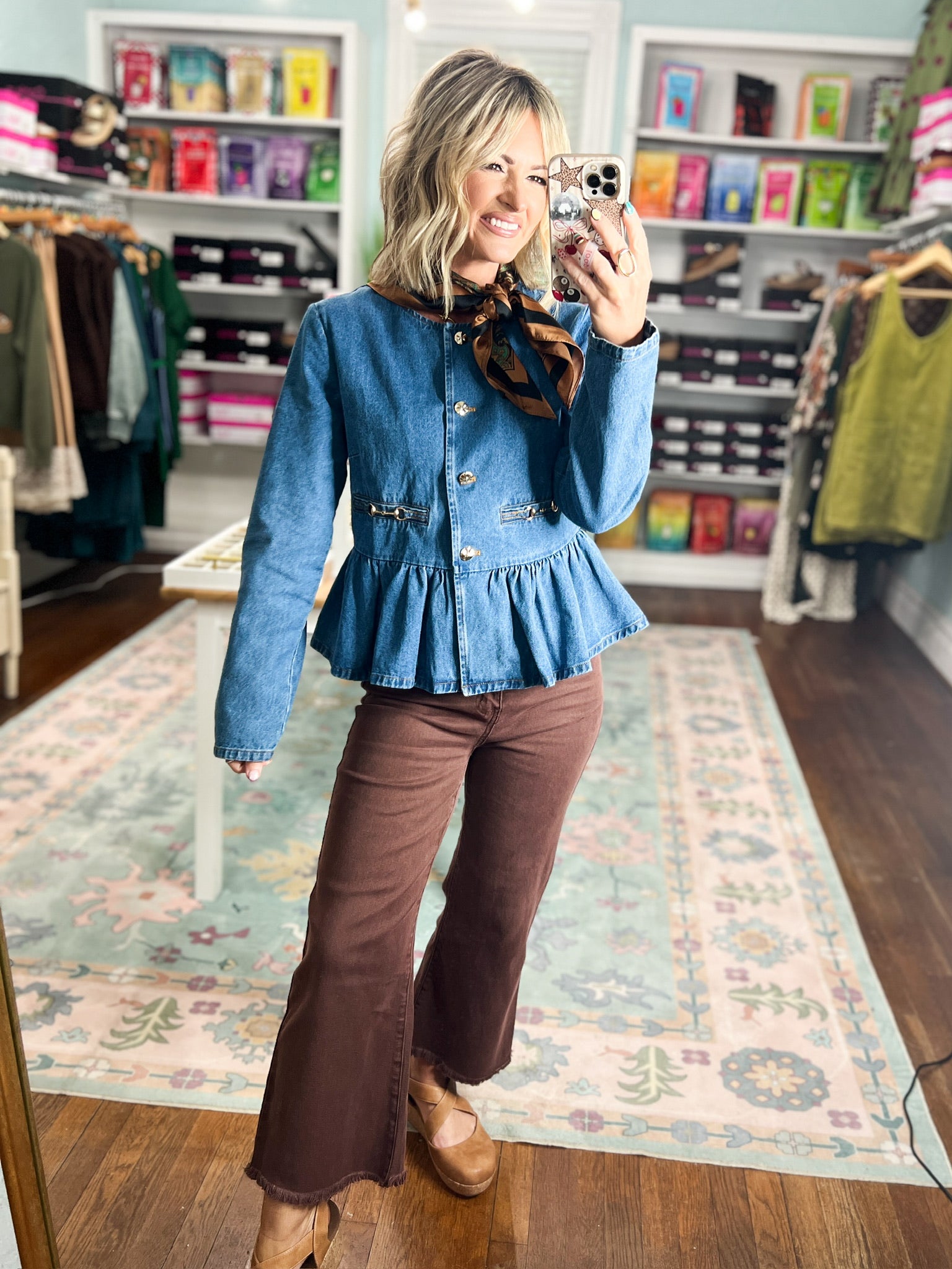 Denim peplum top with long sleeves, button front, and gathered peplum ruffle