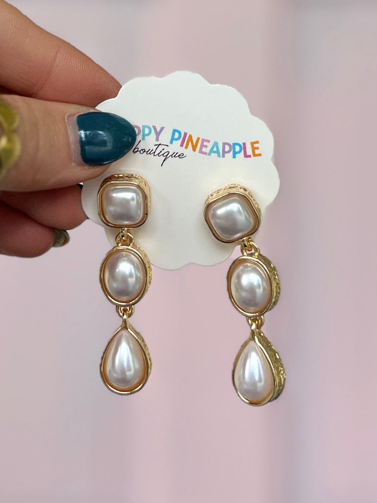 Cream pearl linear drop earrings with gold-tone linked oval and teardrop beads