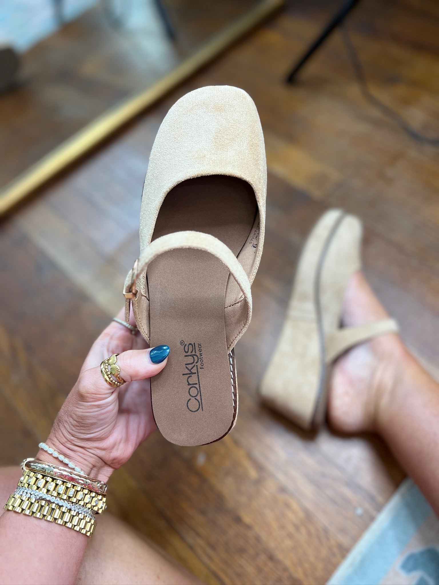 Camel faux suede mule with side buckle strap, slip-on design