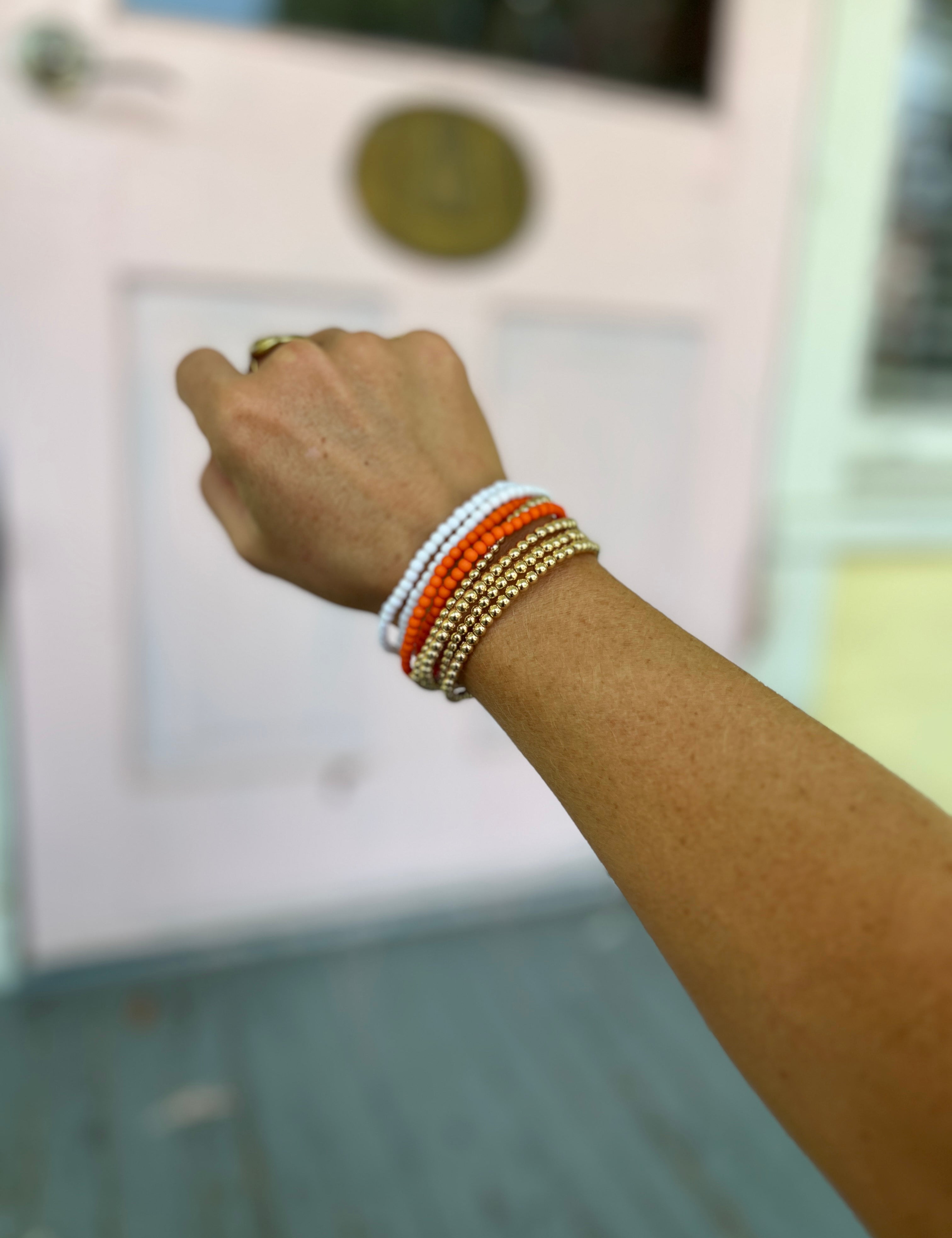CCB ball and acrylic bead bracelet with orange and white bead clusters, elastic fit