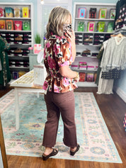 Floral print peplum top with gathered waist bow and short sleeves, brown and pink