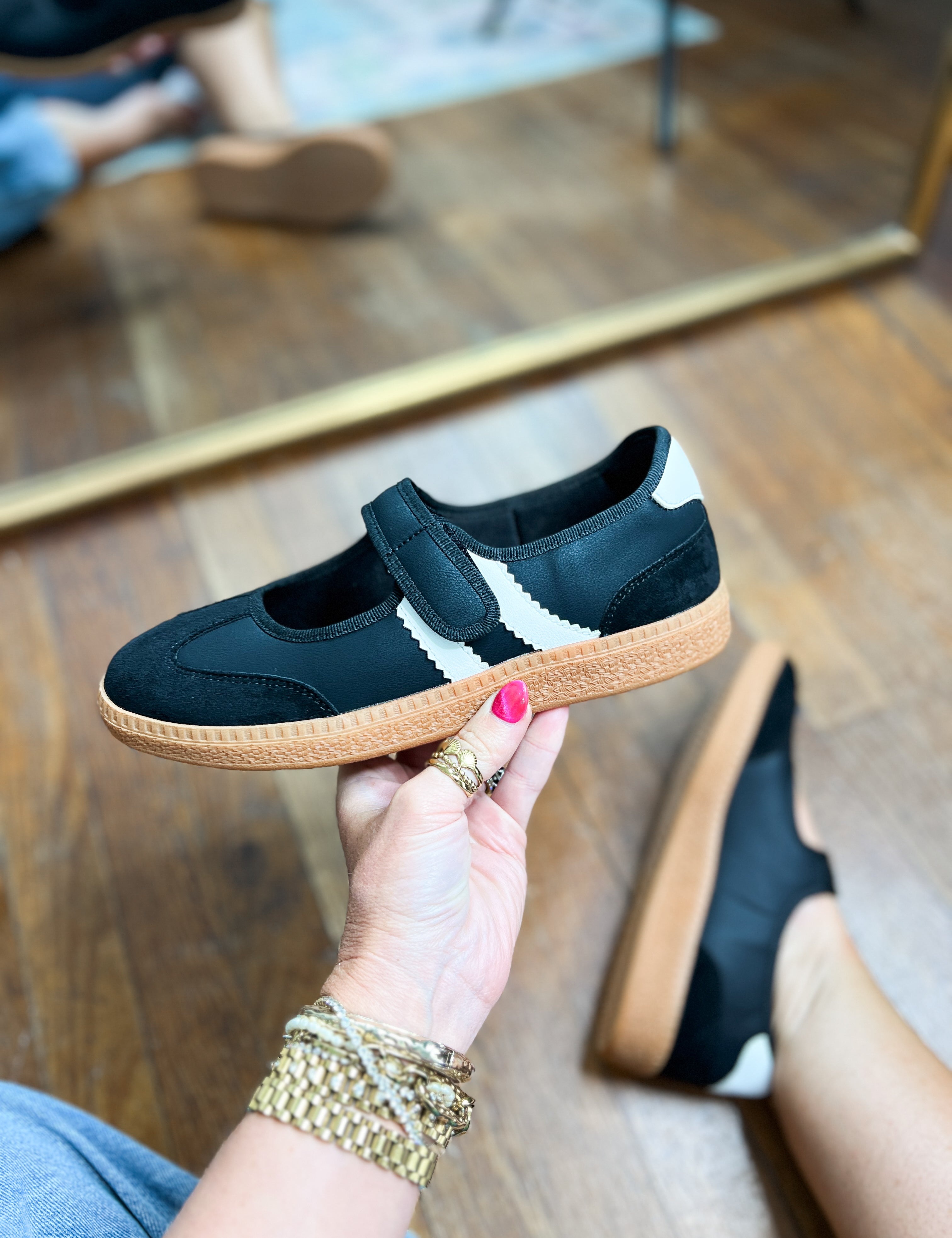 Pair of Corkys Calm Down slip-on sneakers, dark teal suede, tan textured soles