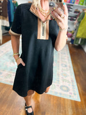 Black casual shift dress with short sleeves and light panel V-neck yoke