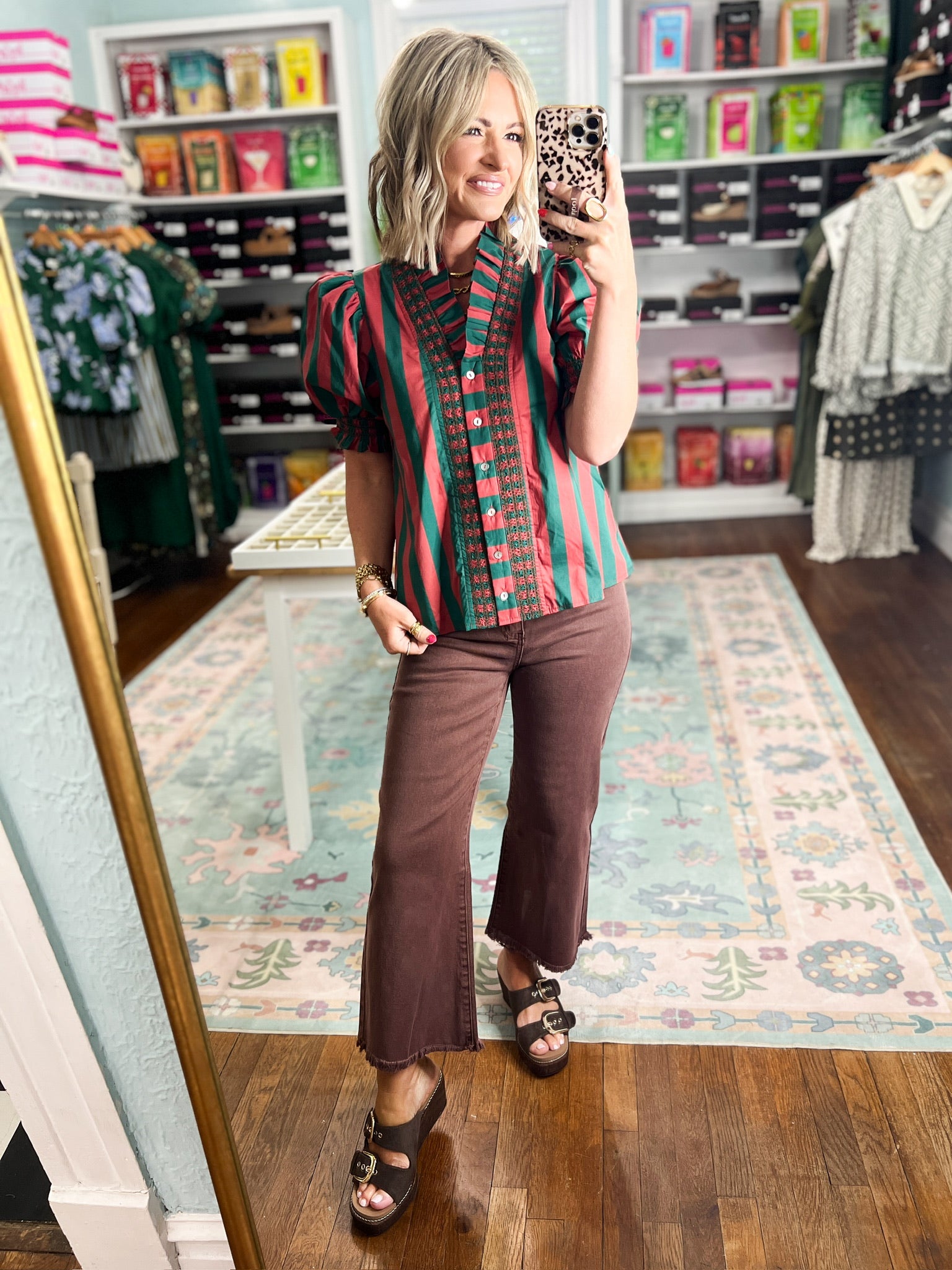 Green and rust striped blouse with gathered shoulders and button front