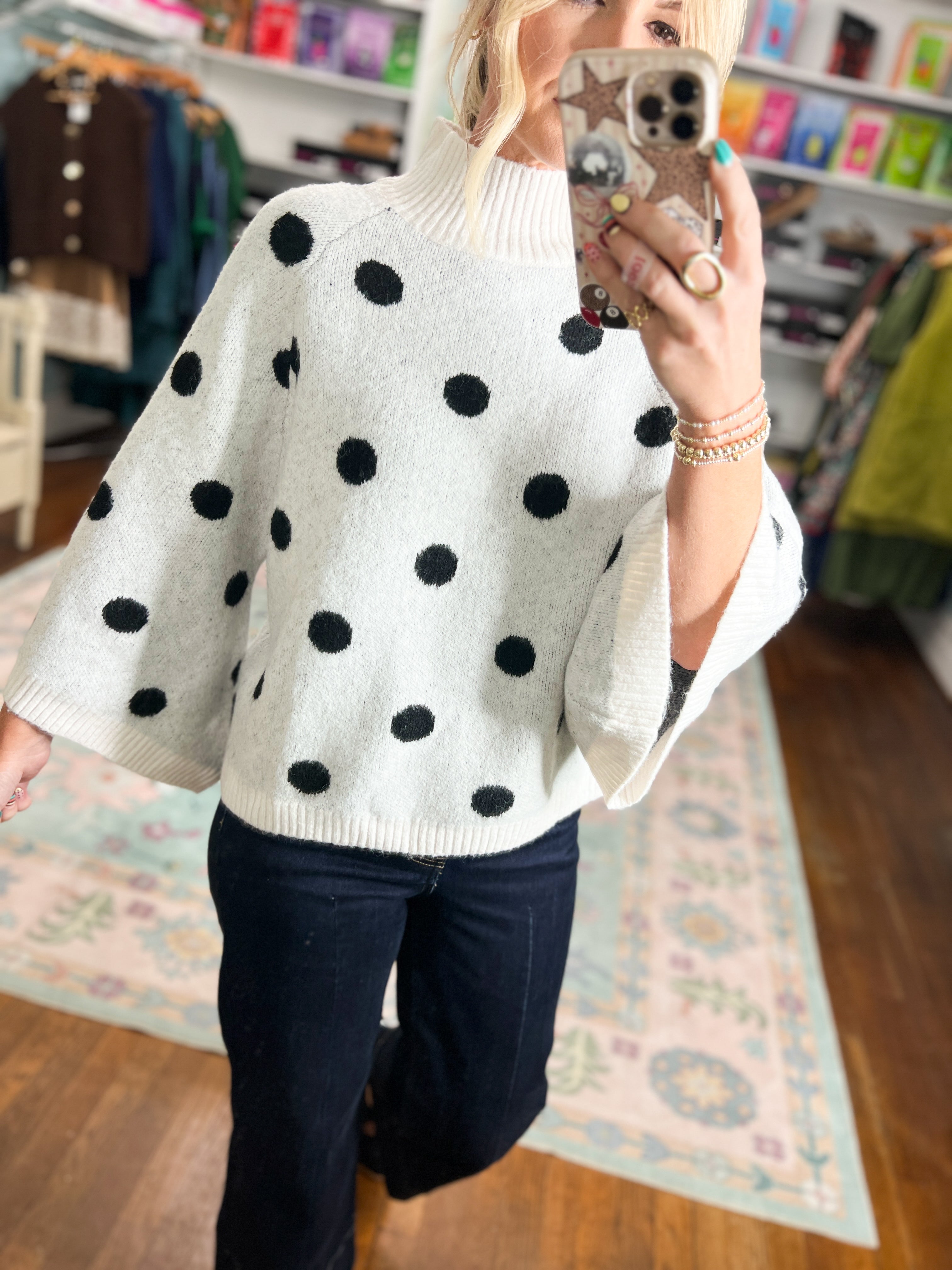 Cream sweater with black polka dots and ribbed mock turtleneck, relaxed fit