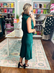 Teal sleeveless midi dress with draped cowl neckline and tied waist bow.