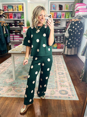 Hunter green polka dot sweater top and pants set, full-body standing
