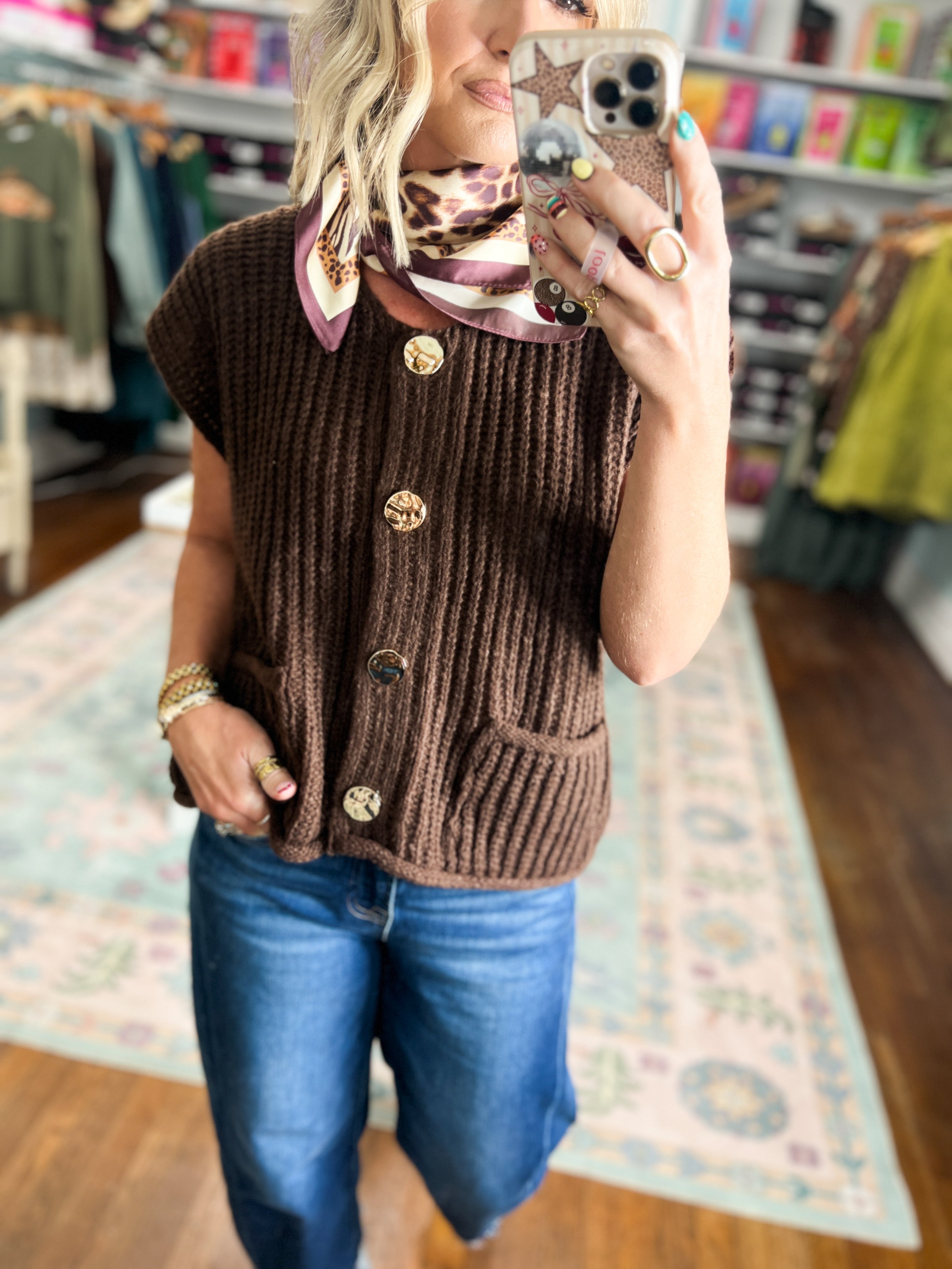 Chocolate brown rib-knit sweater vest with button front and side pockets