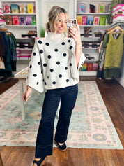 Cream sweater top with black polka dots and ribbed turtleneck, long sleeves