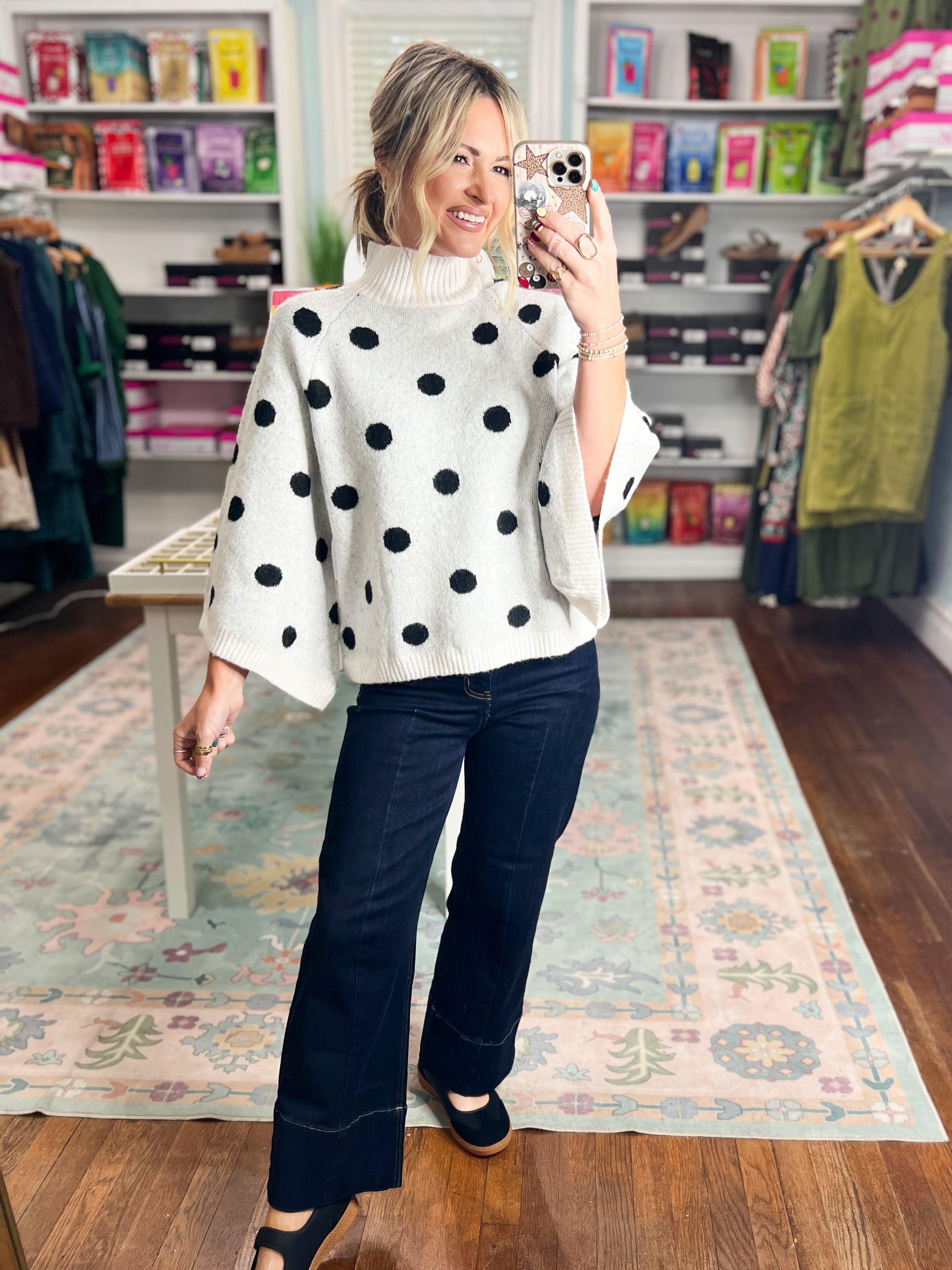 Cream sweater top with black polka dots and ribbed turtleneck, long sleeves