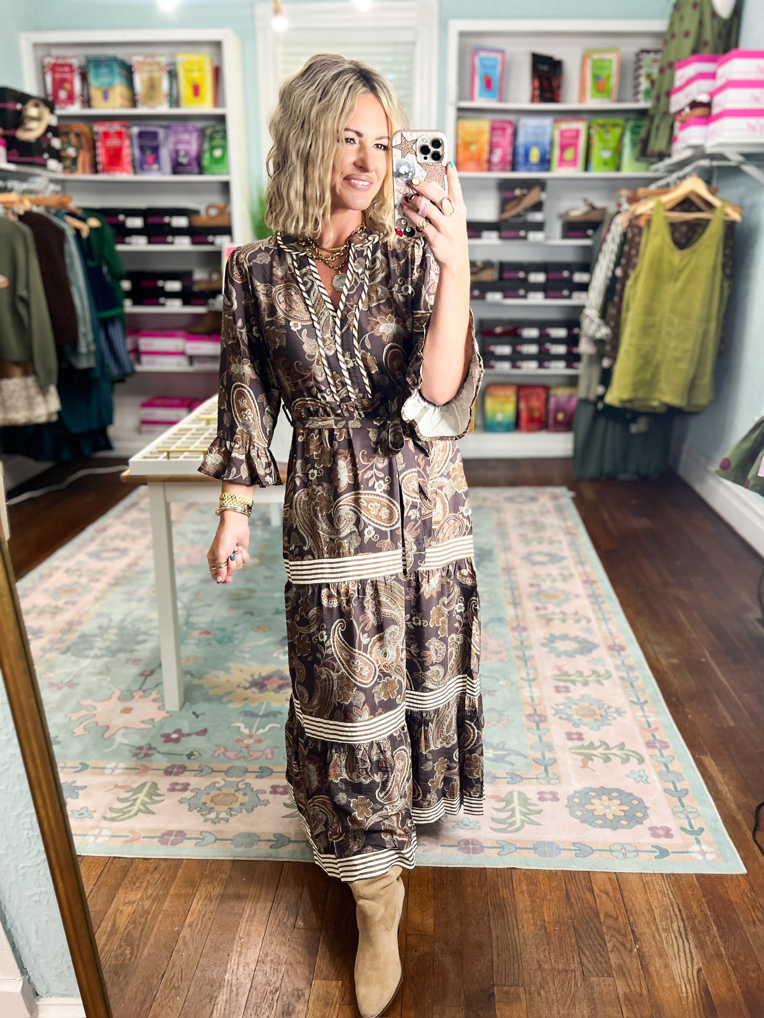 Paisley maxi dress with V neckline, long sleeves, and tiered striped hem border