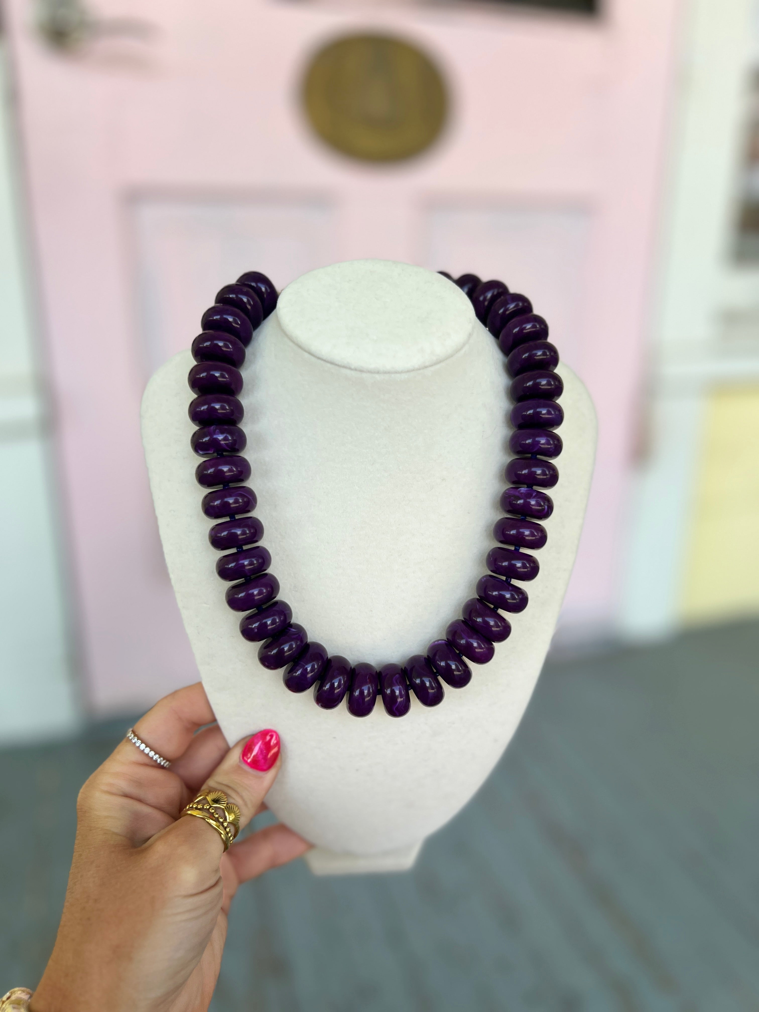 Purple rondelle bead necklace with glossy bead strands
