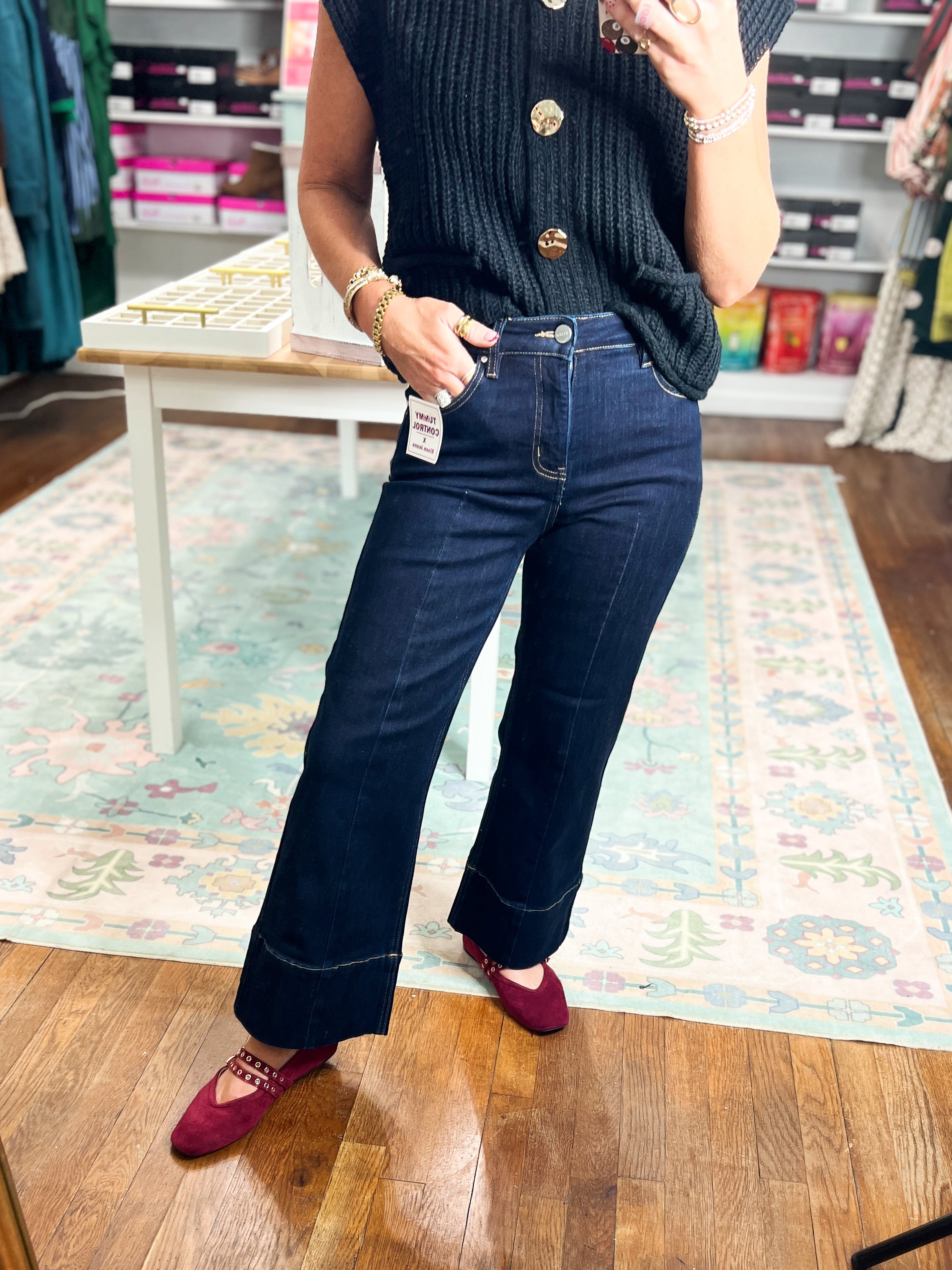 Dark high-rise wide-leg jeans with seam detail, belt loops, and straight hems