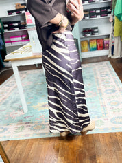 Brown and white zebra-print midi skirt with high waist and floor-length pencil fit