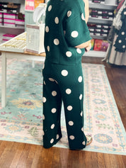 Hunter green knit pants with white polka dots and elastic waist
