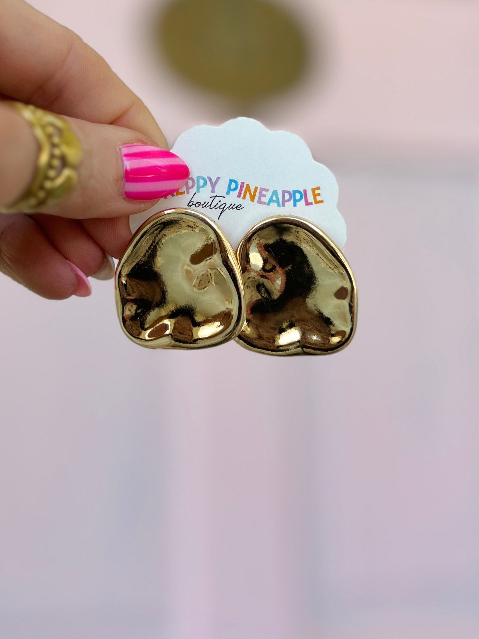 Large gold nugget earrings, two-piece heart-like shape with mirror finish.