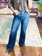 Women's high-rise wide-leg jeans with adjustable waist, blue denim.