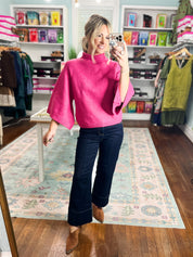 Fuchsia mock neck knit sweater with ribbed neckline and relaxed short sleeves