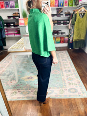 Emerald mock neck knit sweater with side drape