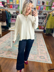 Cream roll-neck seam-detail sweater with center seam, front view