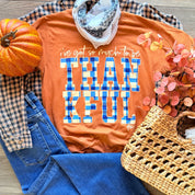 Orange T-shirt with blue 'THANKFUL' block print and white 'I've got so much to be' text