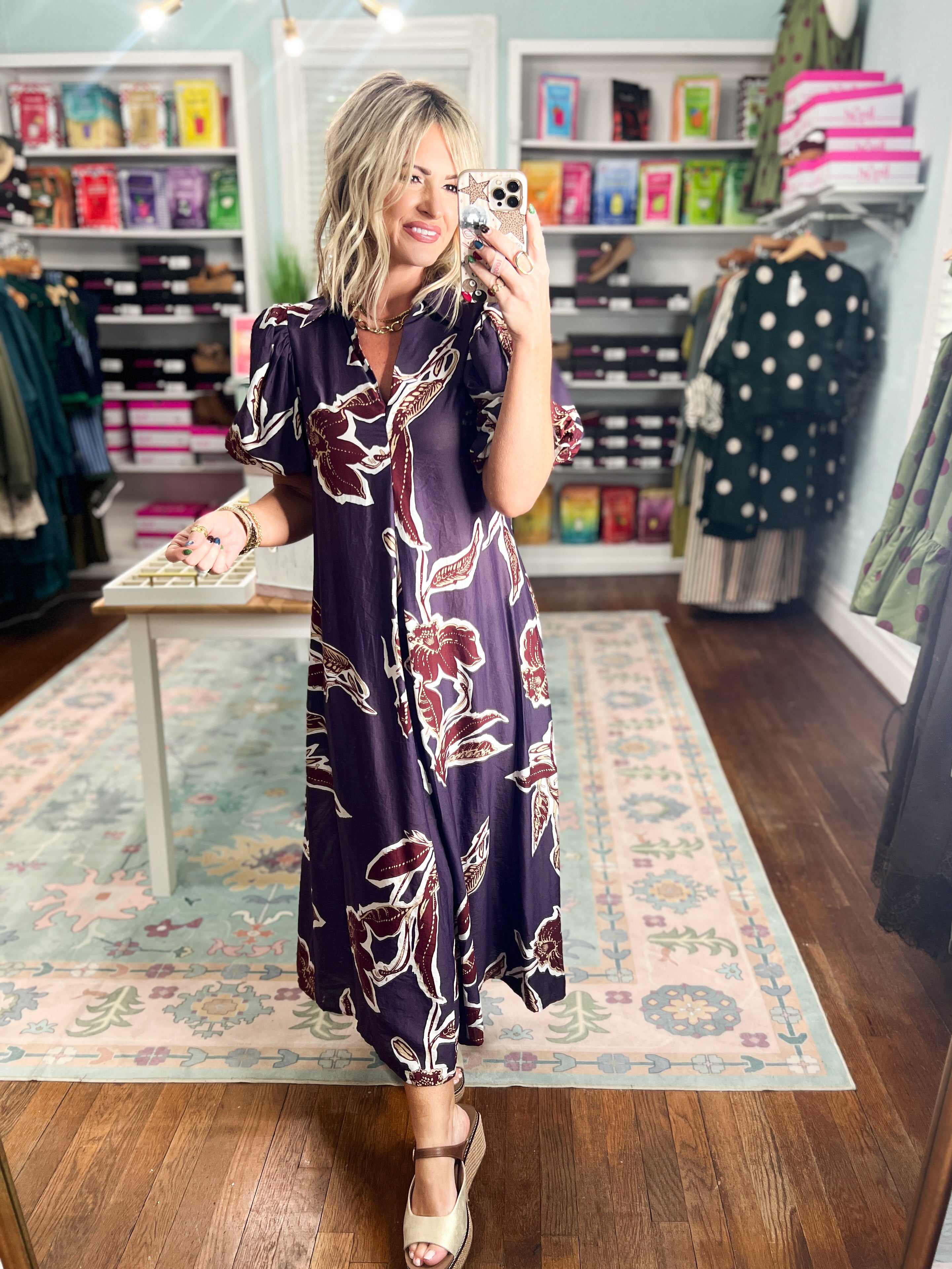 Dark purple puff-sleeve maxi dress with maroon floral print and short V-neck, front