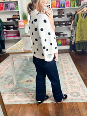 Cream knit sweater with black polka dots, wide sleeves, ribbed neckline