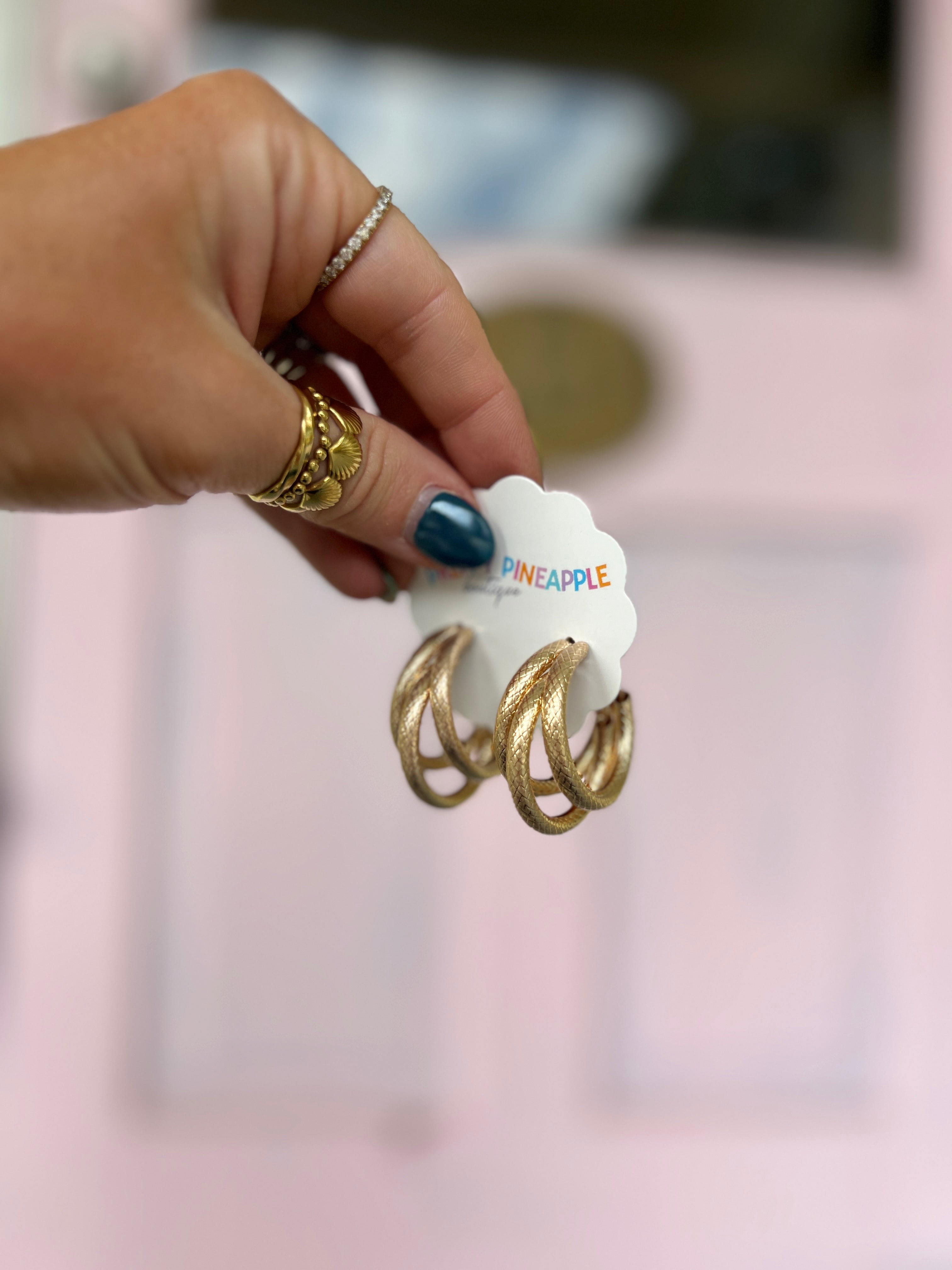 Layered gold hoop earrings with two stacked rings