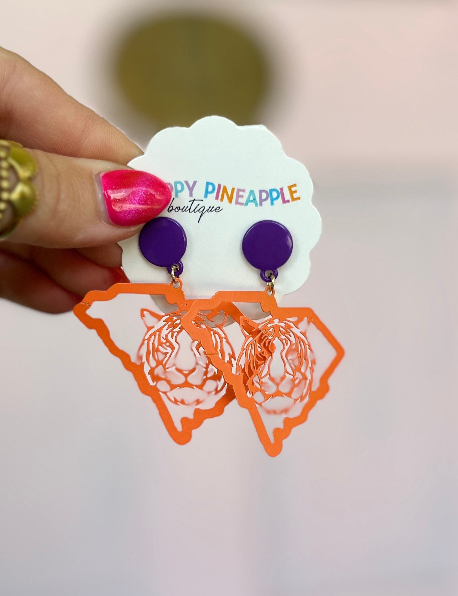 Dangling orange and purple state-map earrings with tiger logo silhouettes