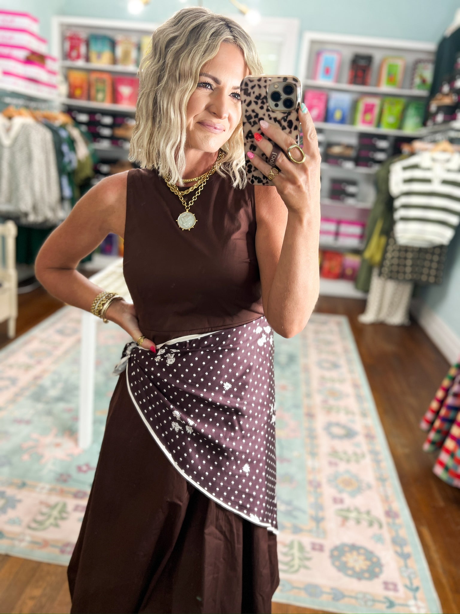 Brown sleeveless midi dress with polka-dot drape at the waist and sleeveless top