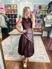 Front view brown sleeveless midi dress with polka-dot waist panel and gathered hem