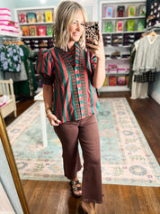 Green and rust striped button-up top with short sleeves and collar