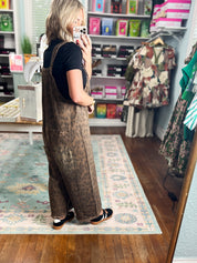 Feline Fine animal-print denim overalls, dark brown bib and wide legs, front pocket