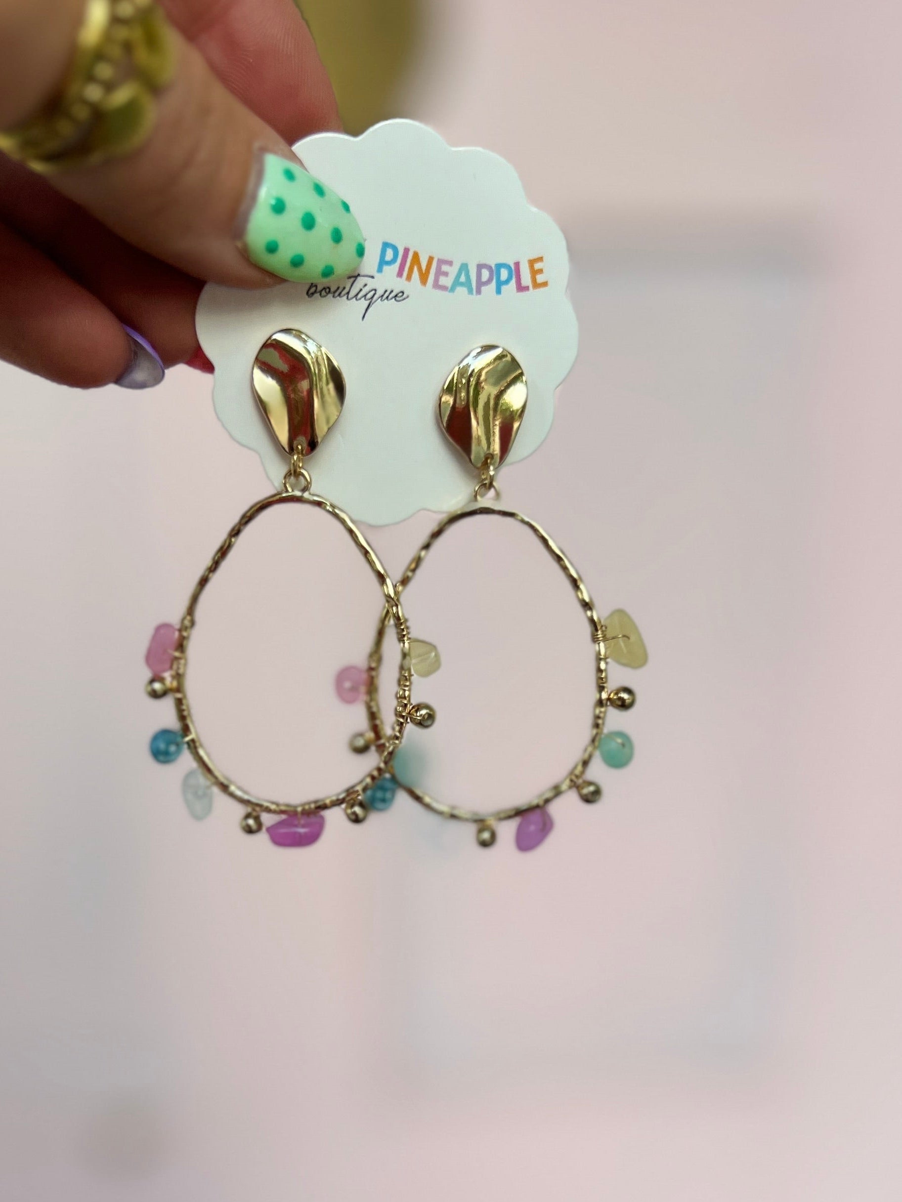 Gold-tone drop hoop earrings with oval stud tops and multicolor bead charms